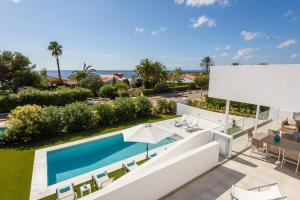 an aerial view of a swimming pool and a resort at VILLA LUCIA B17 in Santo Tomás