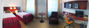 Posteľ alebo postele v izbe v ubytovaní Hotel Atrium