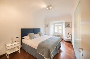 Кровать или кровати в номере Le Dimore di Casa Mattei n°9