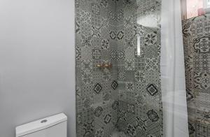 a shower in a bathroom with a shower curtain at Unique Studio House | City Centre in Lisbon