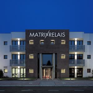 a building with a sign on the front of it at Matrix Hotel & Residence in Vigonza