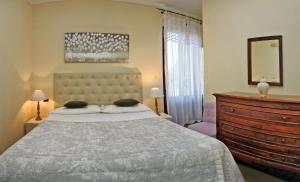 A bed or beds in a room at Claudio Appartamenti
