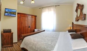 A bed or beds in a room at Claudio Appartamenti