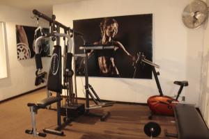a room with a gym with two exercise bikes at Hotel Napoles in San Luis Potosí