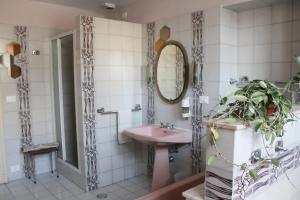 a bathroom with a sink and a mirror at Croisette in Turin