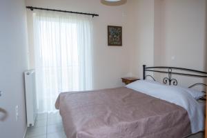 Posteľ alebo postele v izbe v ubytovaní Vithos Apartment