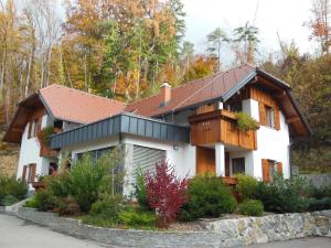a white house with a brown roof at Šport center Prodnik in Ljubno