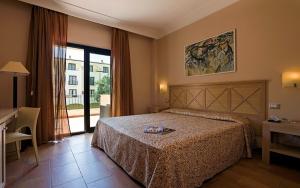 Postel nebo postele na pokoji v ubytování Mahara Hotel & Wellness