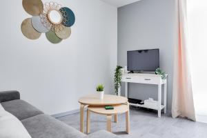 Télévision ou salle de divertissement dans l'établissement Osemae Immobilier - Redon Port-Chatelêt