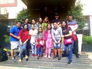 a group of people posing for a picture on steps at Utse Suites in Bangalore