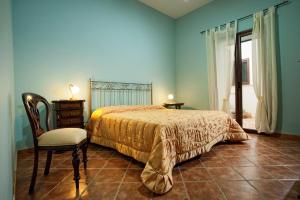 Ένα ή περισσότερα κρεβάτια σε δωμάτιο στο Casale La Zagara