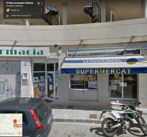 a motorcycle parked in front of a store at Cala Azul 304-306 Tamarit in Tamarit