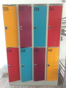 a row of lockers with different colored doors at Udsigten Odsherred in Asnæs