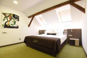 Postel nebo postele na pokoji v ubytování Hotel Castellum + 20 fotografií