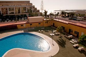 a swimming pool on the roof of a building at Apartments In Los Cristianos, Tenerife, Canary Islands in Los Cristianos
