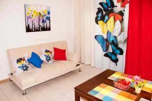 a living room with a couch and a table at Apartments In Los Cristianos, Tenerife, Canary Islands in Los Cristianos