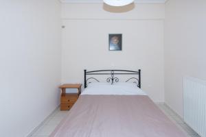 Posteľ alebo postele v izbe v ubytovaní Vithos Apartment