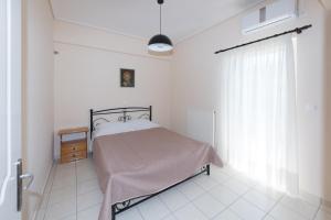 Posteľ alebo postele v izbe v ubytovaní Vithos Apartment