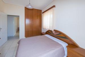 Posteľ alebo postele v izbe v ubytovaní Vithos Apartment