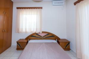 Posteľ alebo postele v izbe v ubytovaní Vithos Apartment