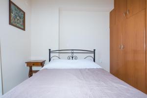 Posteľ alebo postele v izbe v ubytovaní Vithos Apartment