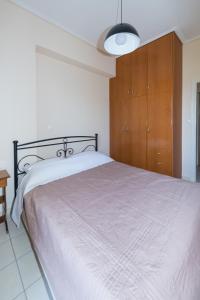 Posteľ alebo postele v izbe v ubytovaní Vithos Apartment