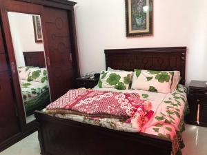 A bed or beds in a room at Emarat Hightes north coast egypt