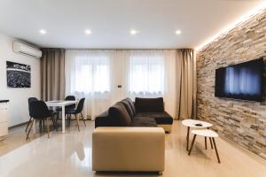 Televízia a/alebo spoločenská miestnosť v ubytovaní SILESIA Apartment