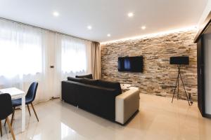 Televízia a/alebo spoločenská miestnosť v ubytovaní SILESIA Apartment