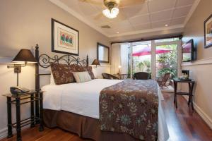 Rúm í herbergi á Grano de Oro Hotel