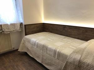 Postel nebo postele na pokoji v ubytování Le Servite Apartments