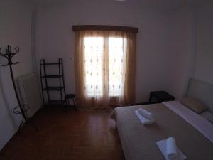 A bed or beds in a room at Sfiggos 54 Guest House