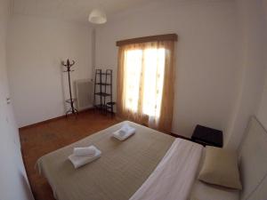 A bed or beds in a room at Sfiggos 54 Guest House