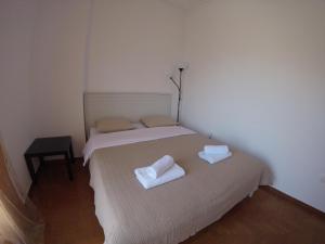 A bed or beds in a room at Sfiggos 54 Guest House