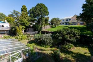 a view of a garden from the roof of a house at Richard & Jill's City House in New Plymouth