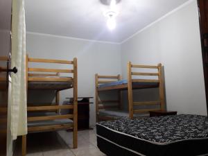 En eller flere senge i et værelse på Casa com Quintal Amplo