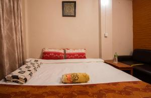 Ein Bett oder Betten in einem Zimmer der Unterkunft Langtang View Nagarkot Bed and Breakfast