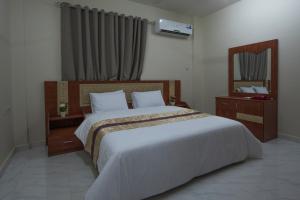 Postel nebo postele na pokoji v ubytování Bahla Jewel Hotel Apartments