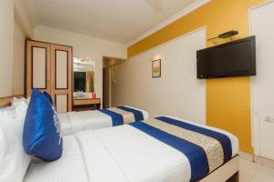 Postel nebo postele na pokoji v ubytování Hotel Mina International
