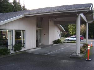 a parking lot in front of a building at Edgewick Inn in North Bend