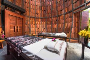 Кровать или кровати в номере The Tubkaak Krabi Boutique Resort
