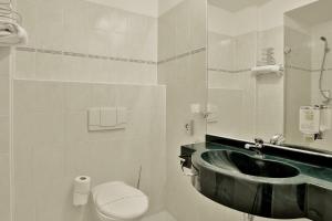 Kúpeľňa v ubytovaní Belvedere Wellness Hotel