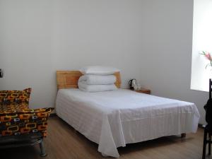 A bed or beds in a room at Hefei Vanward Fashion Short Rent