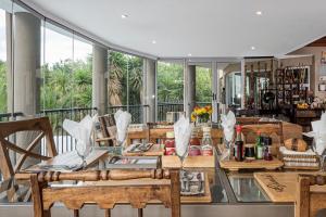 a dining room with a glass table and chairs at Glenda's Guest Suites in Midrand