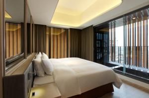 Letto o letti in una camera di 礁溪晶泉丰旅 Wellspring by Silks Jiaoxi