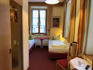 Postel nebo postele na pokoji v ubytování Hotel Waltraud Garni
