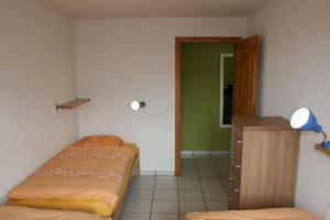 Postel nebo postele na pokoji v ubytování Résidence Castel Club Leysin Parc