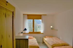 Postel nebo postele na pokoji v ubytování Résidence Castel Club Leysin Parc