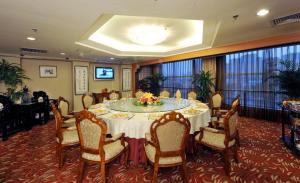 a dining room with a large table and chairs at Super House International in Beijing