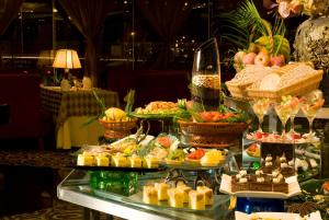 a buffet with many different types of food on a table at Super House International in Beijing